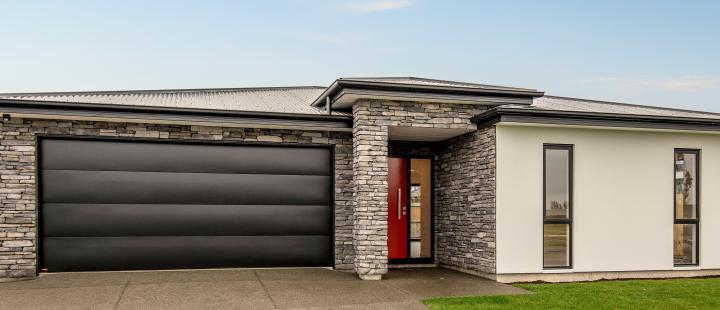 Halswell Residence: Schist and High-Contrast Tonal Layers