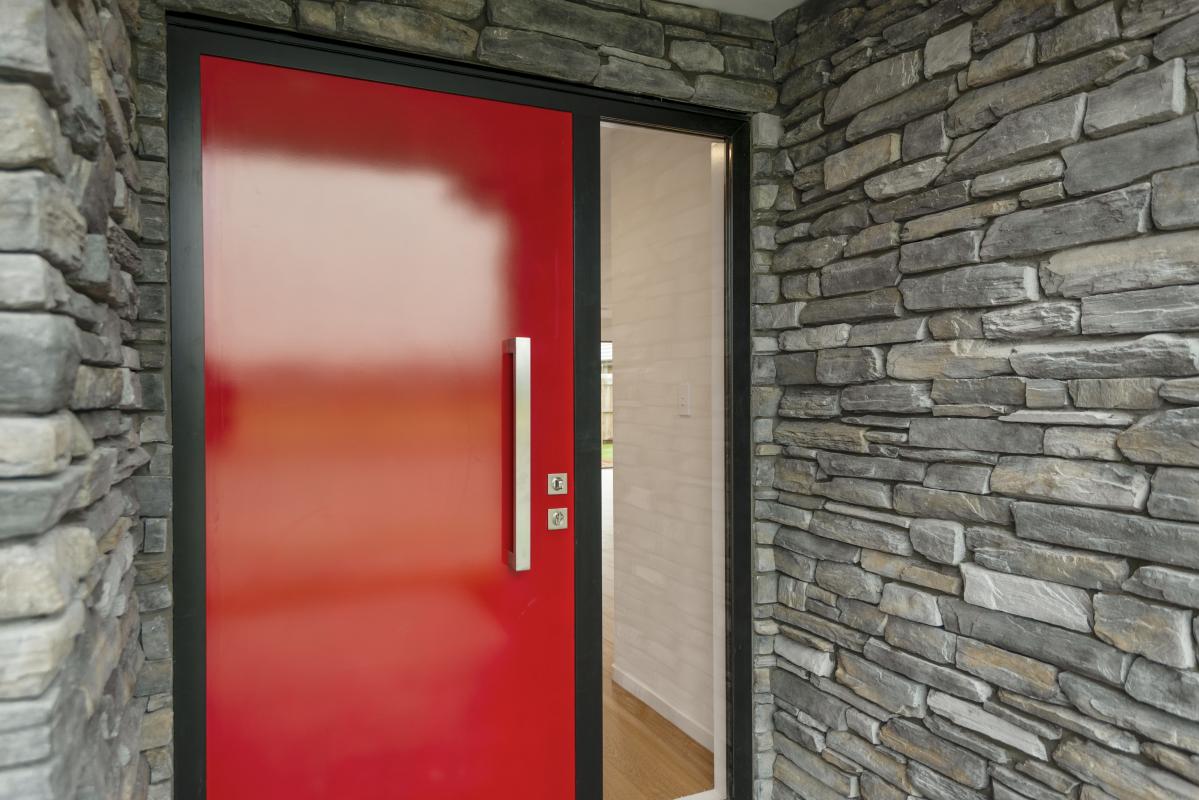 Halswell Residence: Schist and High-Contrast Tonal Layers